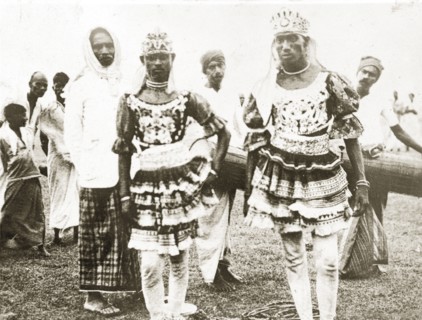Ceylonian dancers. Two Ceylonian men dressed in traditional dance costumes wear ornate headdresses