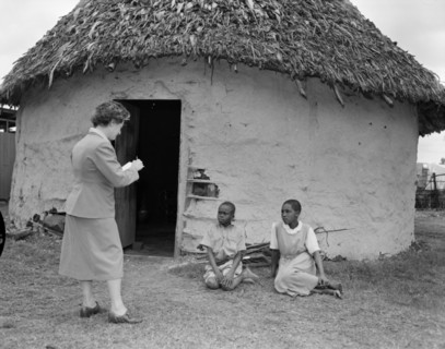 A book artist sketches children. Promotional shot for the East African Literature Bureau. A