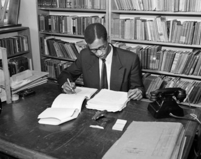 A proof reader at work. Promotional shot for the East African Literature Bureau. An African proof