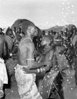 A Turkana couple dancing. A Turkana couple wearing traditional dress and jewellery are absorbed in