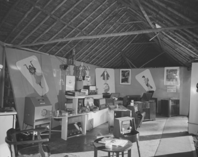 Luxor Radio at the Royal Show. Posters and advertising decorate the walls of the Luxor Radio stand