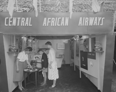 Central African Airways at the Royal Show. A woman dressed in a flight attendant's uniform shows