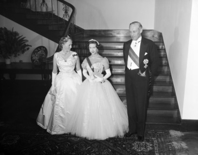 Princess Margaret with Sir Evelyn Baring. Dressed in evening gowns, long gloves and tiaras,