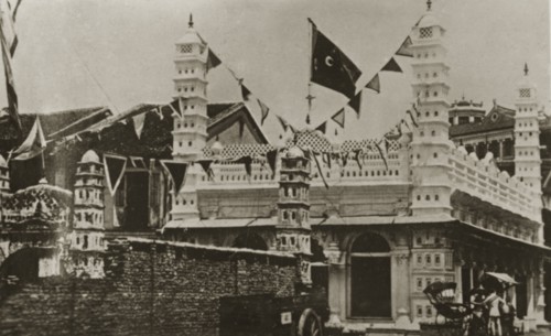 Singapore mosque. Strings of flags decorate an Indian-style mosque in the centre of town.