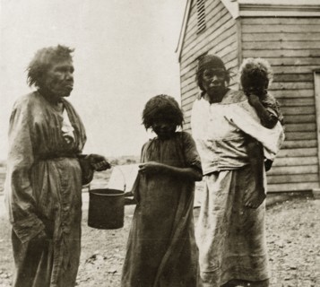 Tarcoola aborigines. Portrait of three female aborigines with a young child taken in the Tarcoola