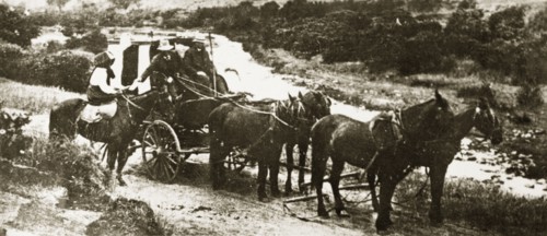 Royal Mail stage coach. The Royal Mail, delivering letters via horsedrawn stage coach in the rural