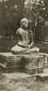Buddah statue. A statue of a Buddha belonging, according to the original caption, to a lost city.