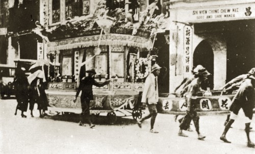 Chinese funeral carriage. An elaborately decorated funeral carriage adorned with wreaths, banners
