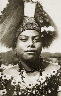Wife of a Samoan chief. The wife of a Samoan chief wears traditional 'meke' costume. Her long hair