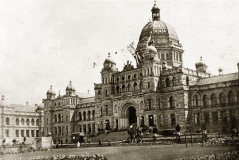Parliament buildings, Victoria. The union jack flag flies high above grandiose parliament buildings