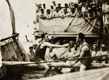 Sports at sea. Two crew members aboard a British Special Service Squadron warship entertain their