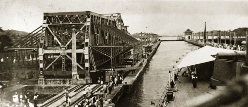 The Gatun locks at Panama. A warship of the British Special Service Squadron enters one of the