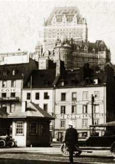 Old town, Quebec. View of shopfronts in the old town with the Chateau Frontenac Hotel visible in