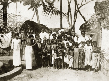 Inhabitants of a Ceylonian village. A large group of Ceylonian adults and semi-naked children