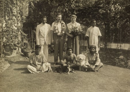 Members of the Leonard household. Alan and Audrey Leonard, adorned with flowers, pose for the