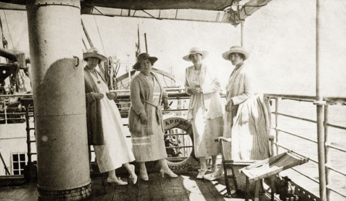 Onboard the 'Appam'. Four European women stand together on the deck of the 'Appam', a cargo and