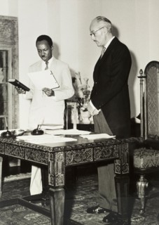 Nyerere takes an oath. Official publicity shot for the Tanganyikan government. Dr Julius Kambarage