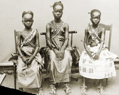 Three Fante girls, Gold Coast. Outdoors portrait of three adolescent girls wearing wrap skirts and