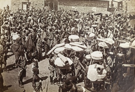 Crowds at a chief's funeral, Accra. An overhead photograph of a large mourning party gathered in