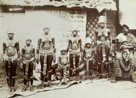 Women in beaded costume. Outdoors portrait of girls and young women wearing elaborate beaded and