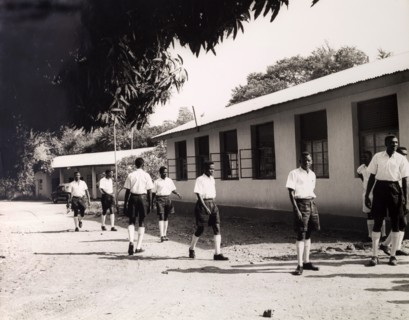 Tanganyikan students outside college. Official publicity shot for the Tanganyikan government. Young