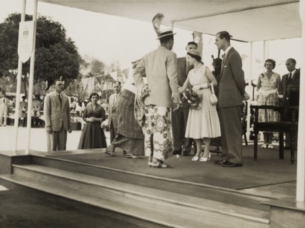 Queen Elizabeth meets a Nigerian chief. Queen Elizabeth II greets a Nigerian chief and his wife