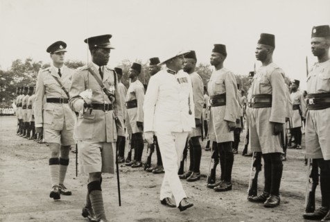 Inspection of the King's African Rifles. A European military officer, possibly a colonial Governor,