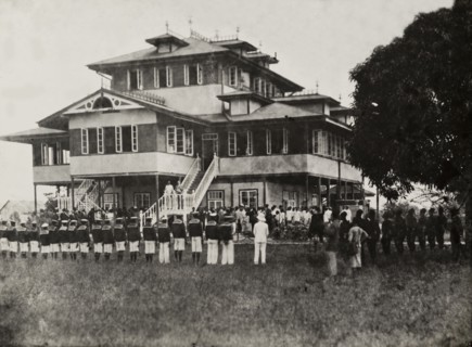 Empire Day at the Vice Consulate of Bonny. Lines of uniformed Nigerian men take part in a parade