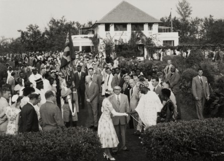 Queen Elizabeth II at a garden party in Nigeria. Queen Elizabeth II shakes hands with a Nigerian
