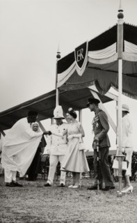 Queen Elizabeth II meets Dr Nnamdi Azikiwe. Dr Nnamdi Azikiwe, Premier of Eastern Nigeria, shakes