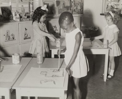 A mixed race class. A Northern Rhodesian Information Department photograph shows three young