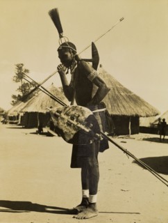 Tonga man in mourning dress. Full-length profile portrait of a Tonga man wearing traditonal