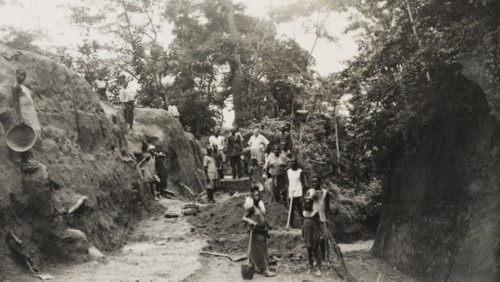 Widening the road from Imesi-Ile. A local labour force of men, women and children work to widen the