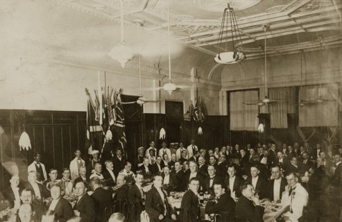 Burns Night in Bombay. A large group of formally dressed British gentlemen pose for the camera,