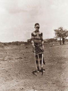 An African dancer at Balloch Farm. Outdoors portrait of an African dancer at Balloch Farm. He holds