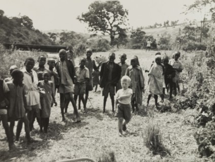 Neville Lewis plays with Kikuyu children. Neville Lewis, the eldest son of English Methodist