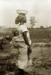 Nigerian woman and baby in profile. Profile portrait of a Nigerian women, identified by an original