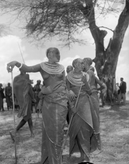 Female Maasai dancers. Two young Maasai women wearing traditional dress and ornate jewellery pause