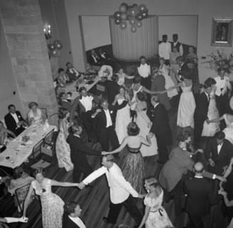 Dancing the 'Eightsome Reel'. European party guests fill the dancefloor to dance the 'Eightsome