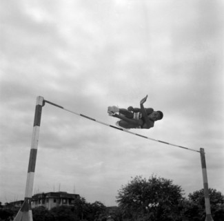 Joseph Lenesae jumps the bar. Kenyan high jumper Joseph Lenesae is captured in mid-air as he