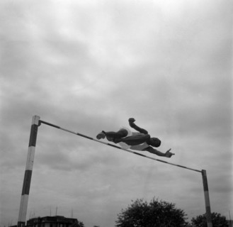 Patrick Etola jumps the bar. Ugandan high jumper Patrick Etola stretches over the high jump pole at
