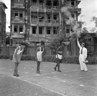 On the starting blocks. A starting pistol fires for three Olympic athletes on the starting line of
