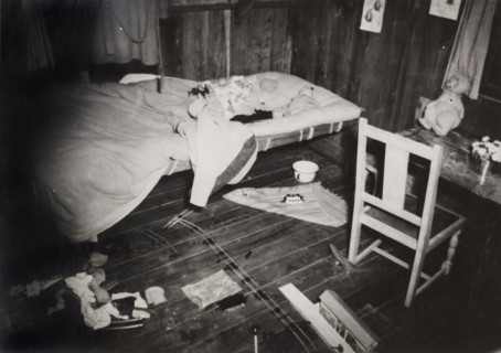 Michael Ruck's bedroom. A pool of blood stains a dishevelled bed in the toy-filled room of Michael