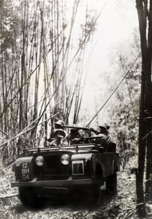 King's African Rifles patrol. A military jeep, driven by armed men from the King's African Rifles,