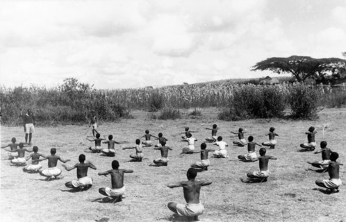 Kikuyu children exercising. Children perform coordinated exercises in a secure village established
