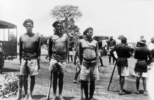 Three Home Guards. Three Kikuyu Home Guards stand to attention for their photograph, wearing