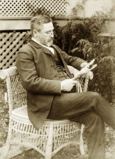 Dr Taylor relaxes at 'Nundora'. Portrait of a well-dressed gentleman identified as 'Dr Taylor'