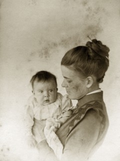 Ellen May Pughe and baby. Portrait of Ellen May Pughe holding her baby, one of her four children