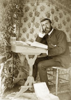 In contemplation with books, Australia. Amateur portrait of a man, possibly an Anglican vicar, in