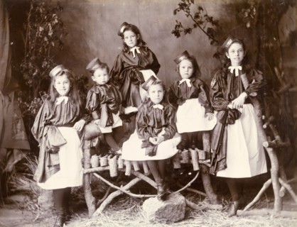 Portrait of girls in uniform, Murree. A family of girls pose for the camera wearing distinctive
